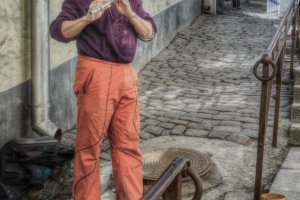 busker playing flute in Tallinn