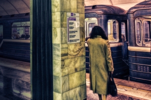 lady in subway station at night